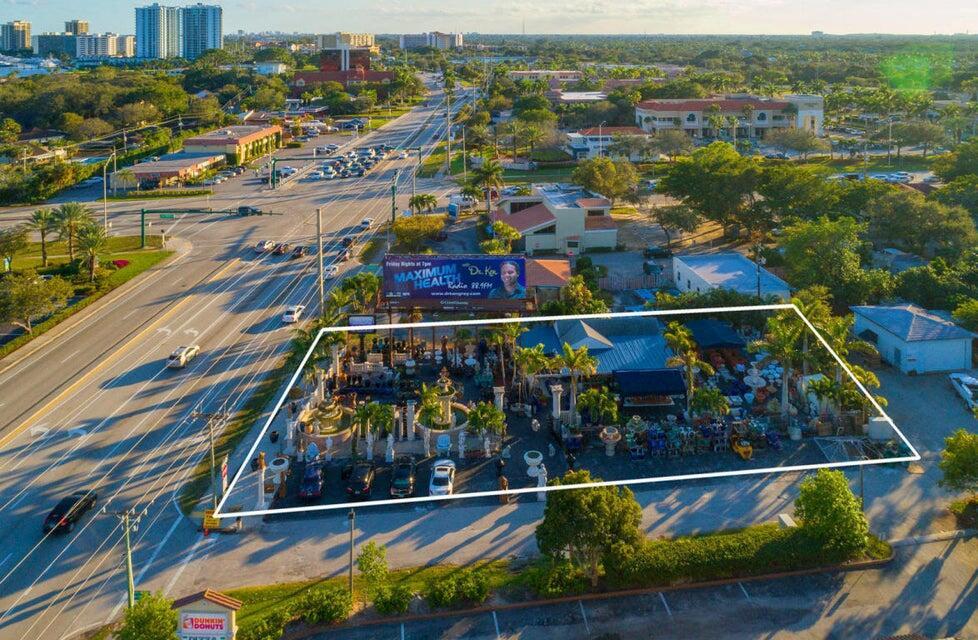 An aerial view shows a commercial property featuring an outdoor display of fountains and statues — 11555 Us-1, North Palm Beach FL 33408, NORTH PALM BEACH, FL