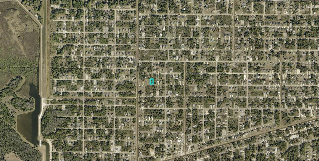 This is an aerial map view of a residential neighborhood with a highlighted property lot — 3008 40TH STREET W, LEHIGH ACRES, FL