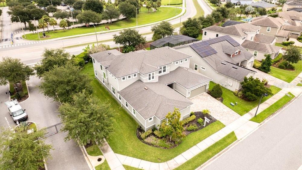 An aerial view shows a two-story suburban house with a gray roof and paved driveway — 14825 ELLINGSWORTH LANE, WINTER GARDEN, FL