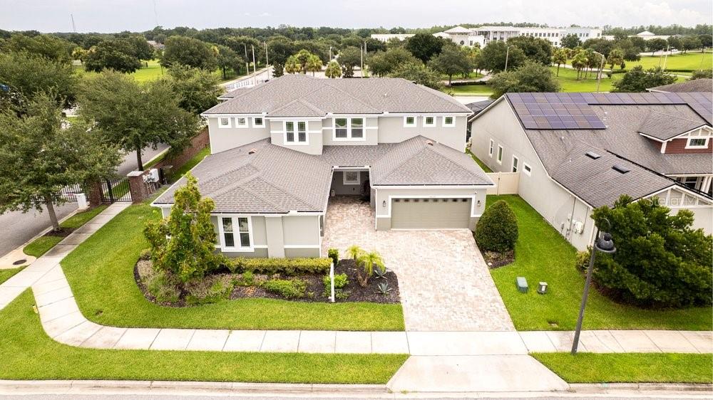 An aerial view of a two-story suburban house with a paved driveway and gray roof — 14825 ELLINGSWORTH LANE, WINTER GARDEN, FL