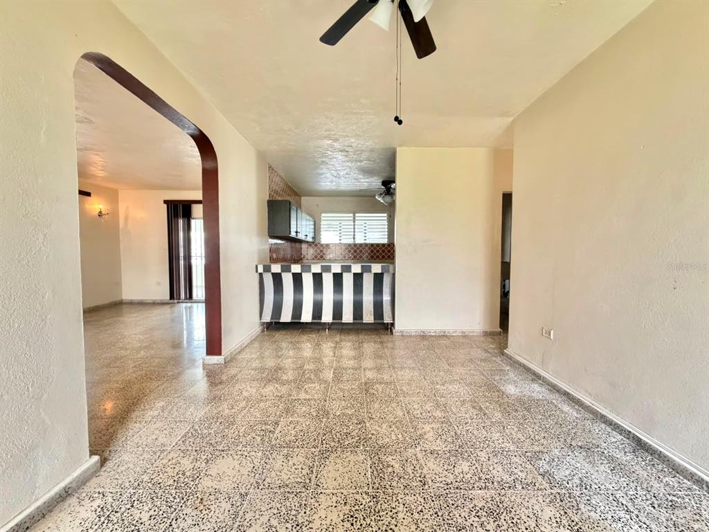 A view of an interior space with tiled floors, a kitchen counter, and an arched doorway — PR 917 KM 1.8, LAS PIEDRAS, PR