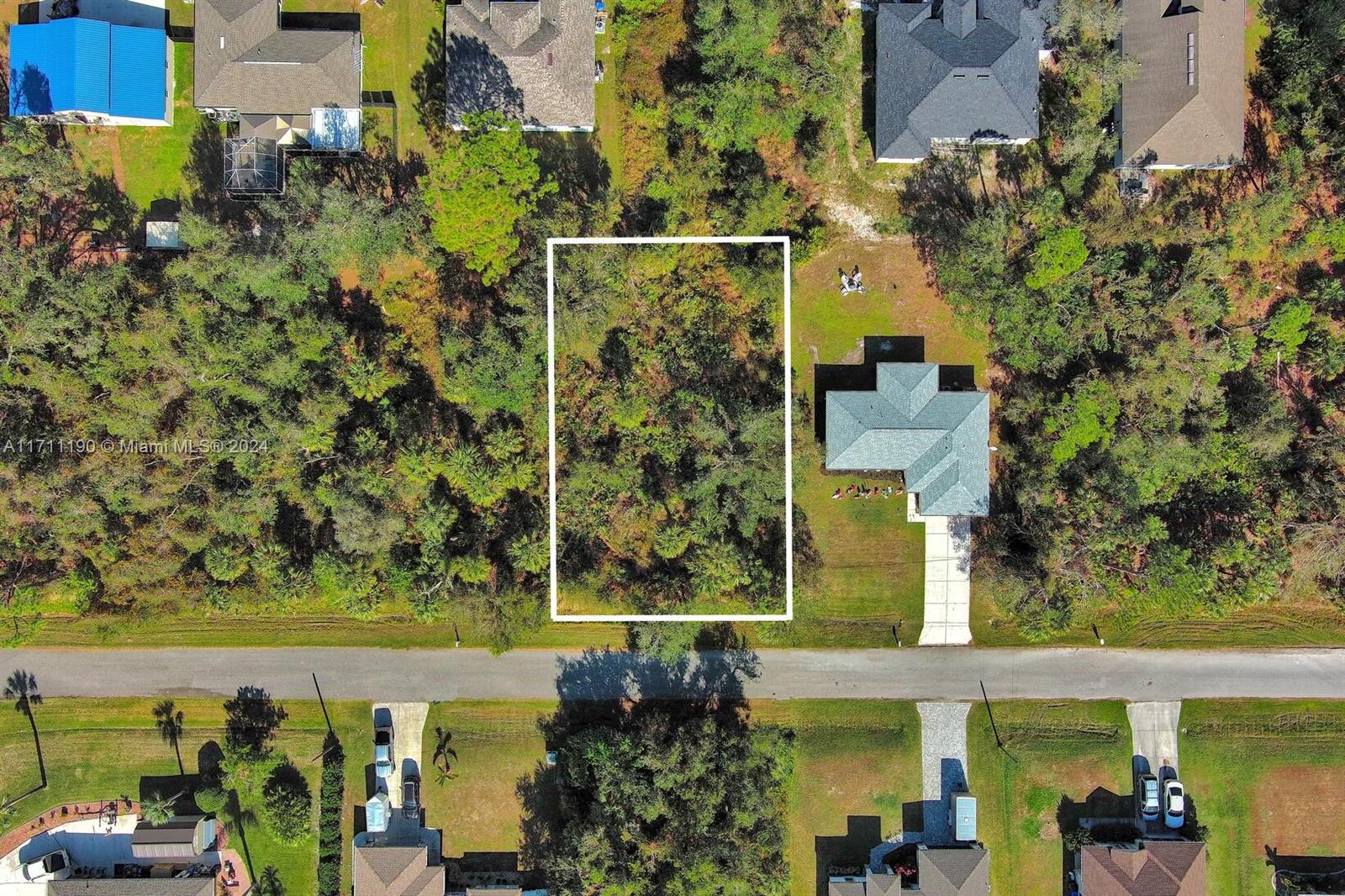 An aerial view shows a rectangular vacant lot outlined in white next to a residential house — #2 Sargon Ave, North Port FL 34287, NORTH PORT, FL