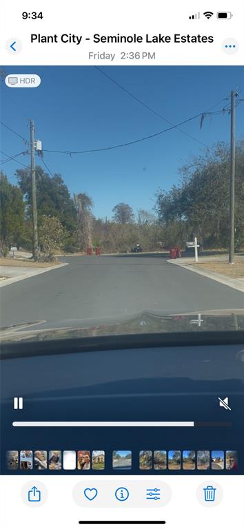 A view from a vehicle looking down a residential street in a neighborhood — 3301 N LAKE DRIVE, PLANT CITY, FL