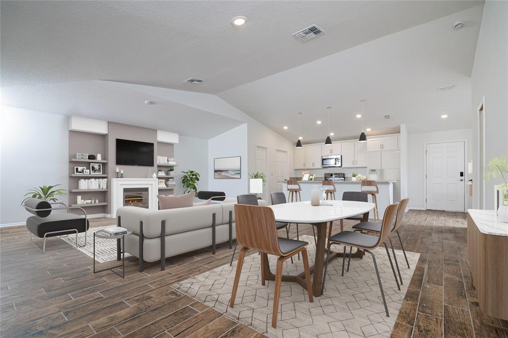 This is a digital rendering of an open-concept living and dining area with vaulted ceilings — 1917 TRAPPER AVENUE SE, PALM BAY, FL