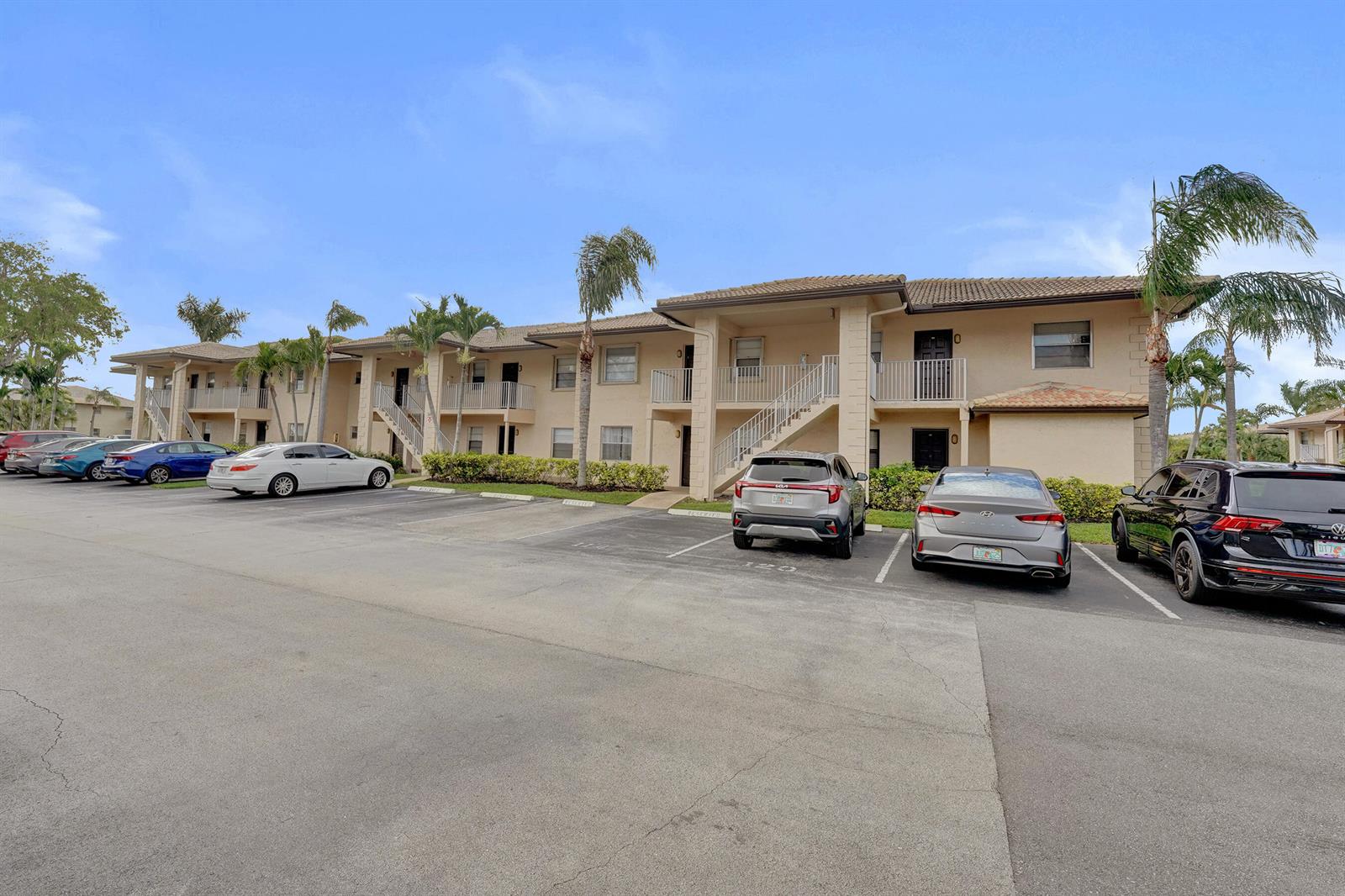 A two-story apartment building with a parking lot in the foreground — 5531 Lakeside Drive # 202, Margate FL 33063, MARGATE, FL