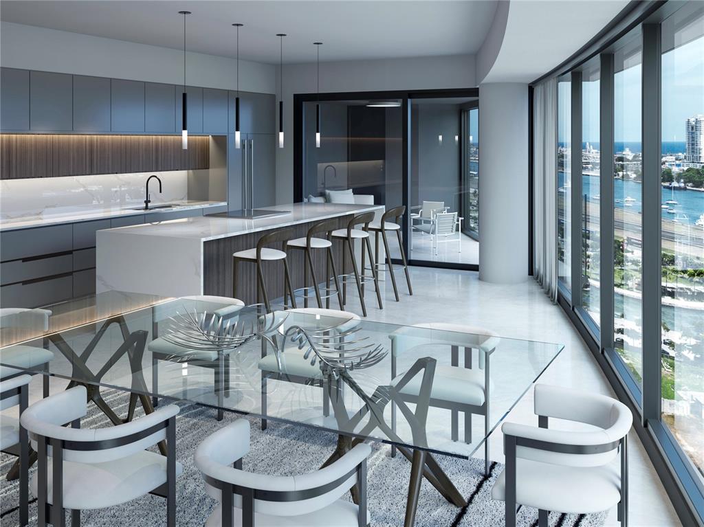 This rendering shows a modern kitchen and dining area with floor-to-ceiling windows overlooking water — 611 BALDORIOTY DE CASTRO BOULEVARD UNIT 1102, SAN JUAN, PR