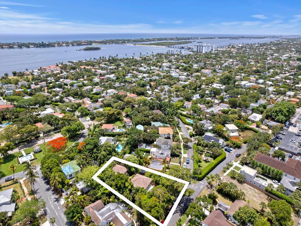 An aerial view shows a residential property outlined in white amidst a lush, tree-filled neighborhood — 333 Marlborough Road, West Palm Beach FL 33405, WEST PALM BEACH, FL
