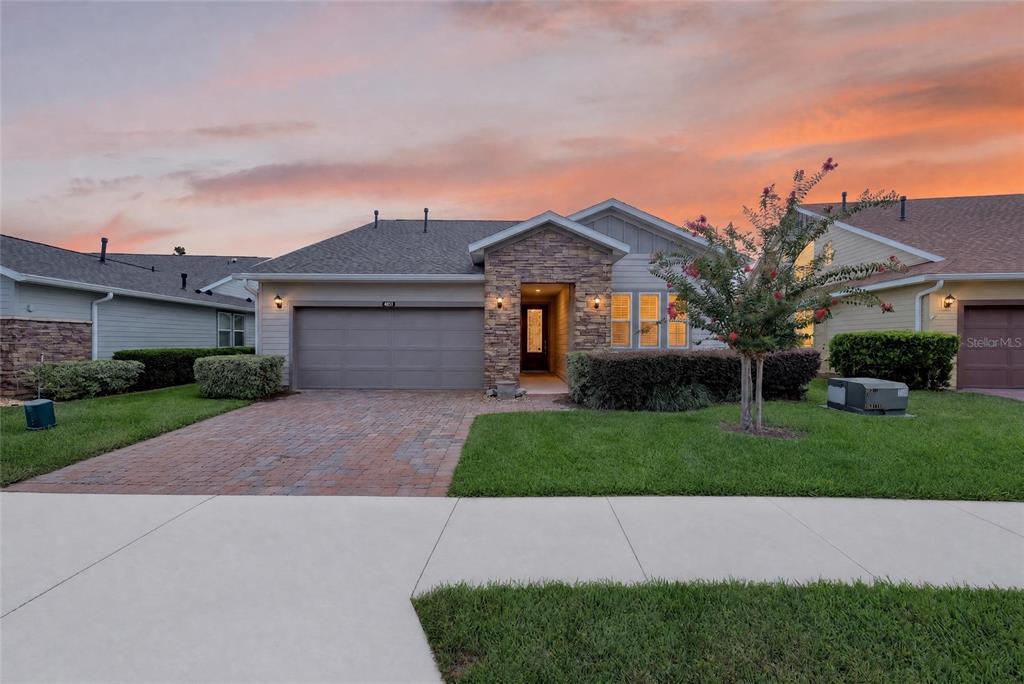 A single-story house with a stone facade, a two-car garage, and a paved driveway — 4967 NW 35TH LANE ROAD, OCALA, FL