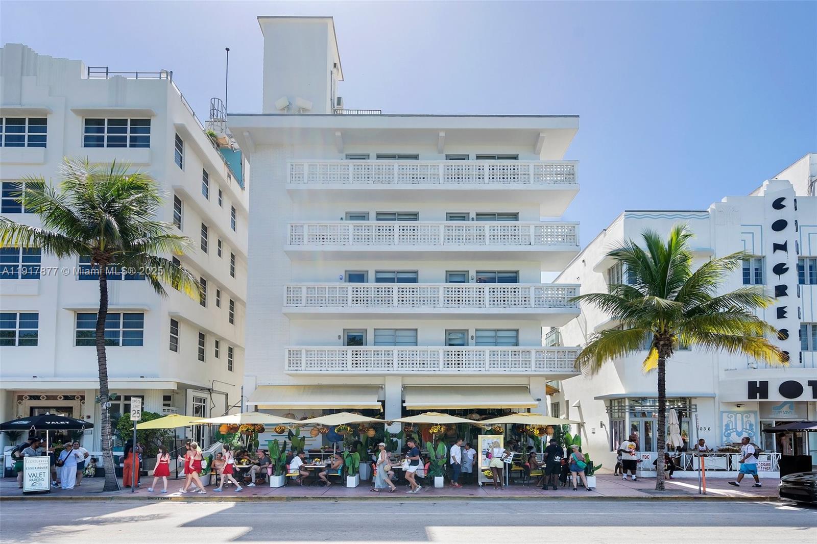 A white multi-story hotel building with a ground-floor restaurant and palm trees in front — 1024 Ocean Dr # A502, Miami Beach FL 33139, MIAMI BEACH, FL