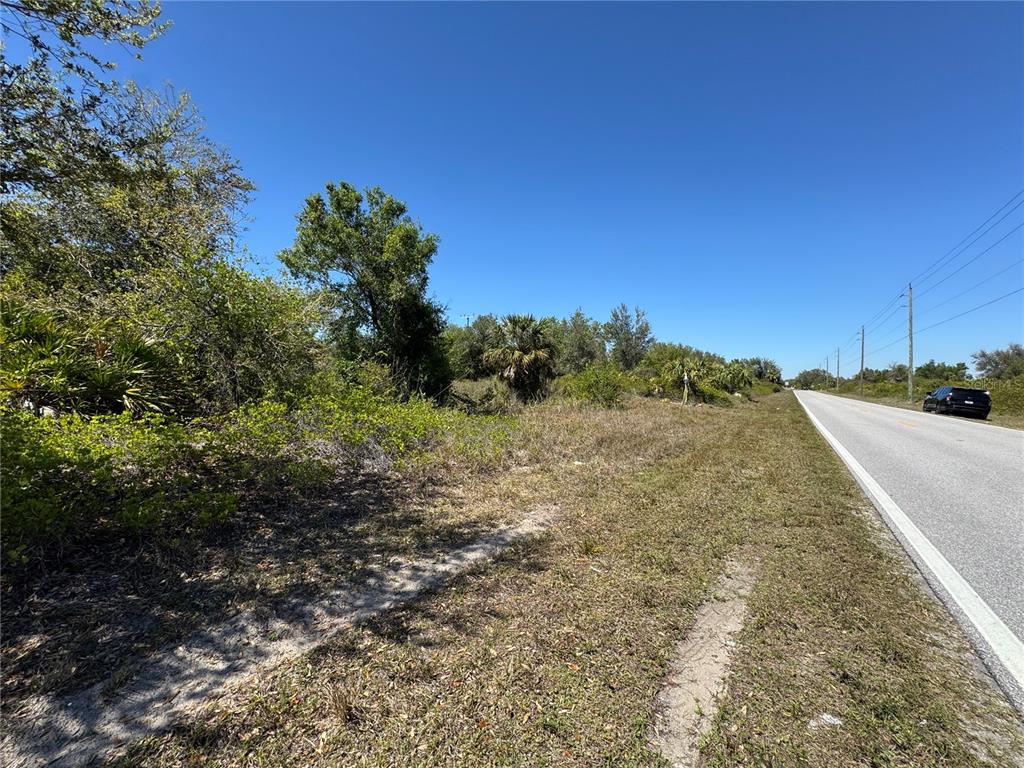 This is an aerial map showing residential lots, streets, and bodies of water — 1491 SULSTONE DRIVE, PUNTA GORDA, FL