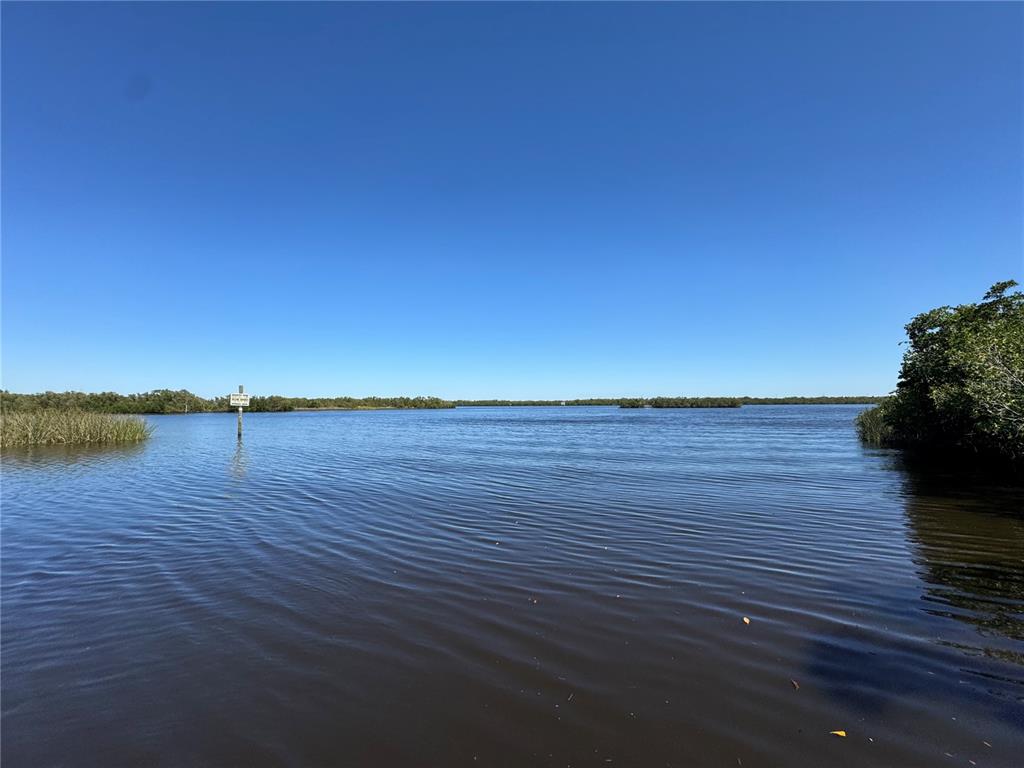 This is a satellite map view showing residential lots and waterways in a coastal area — 1491 SULSTONE DRIVE, PUNTA GORDA, FL