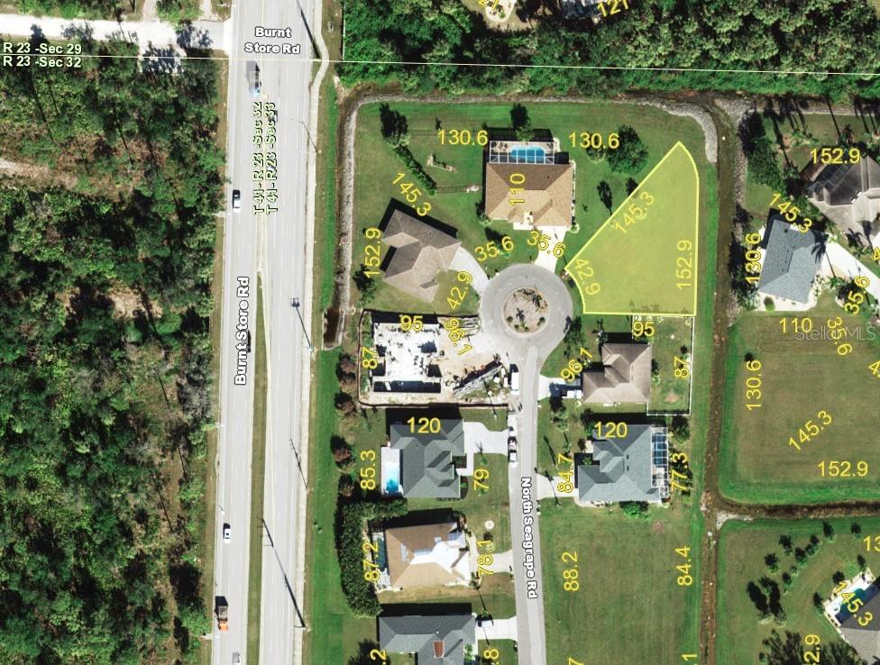 This is an aerial map showing a residential cul-de-sac with a highlighted vacant lot — 7322 N SEAGRAPE ROAD, PUNTA GORDA, FL