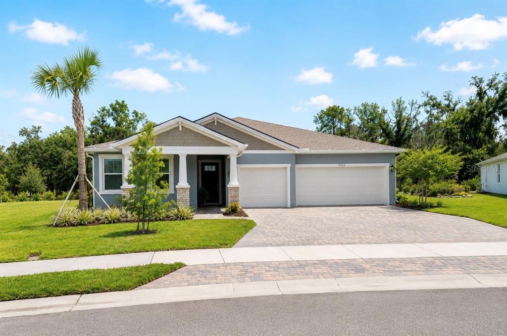 This informational flyer highlights features of a 2025 Mattamy Homes property in Windwater, Florida — 5322 124TH AVENUE E, PARRISH, FL