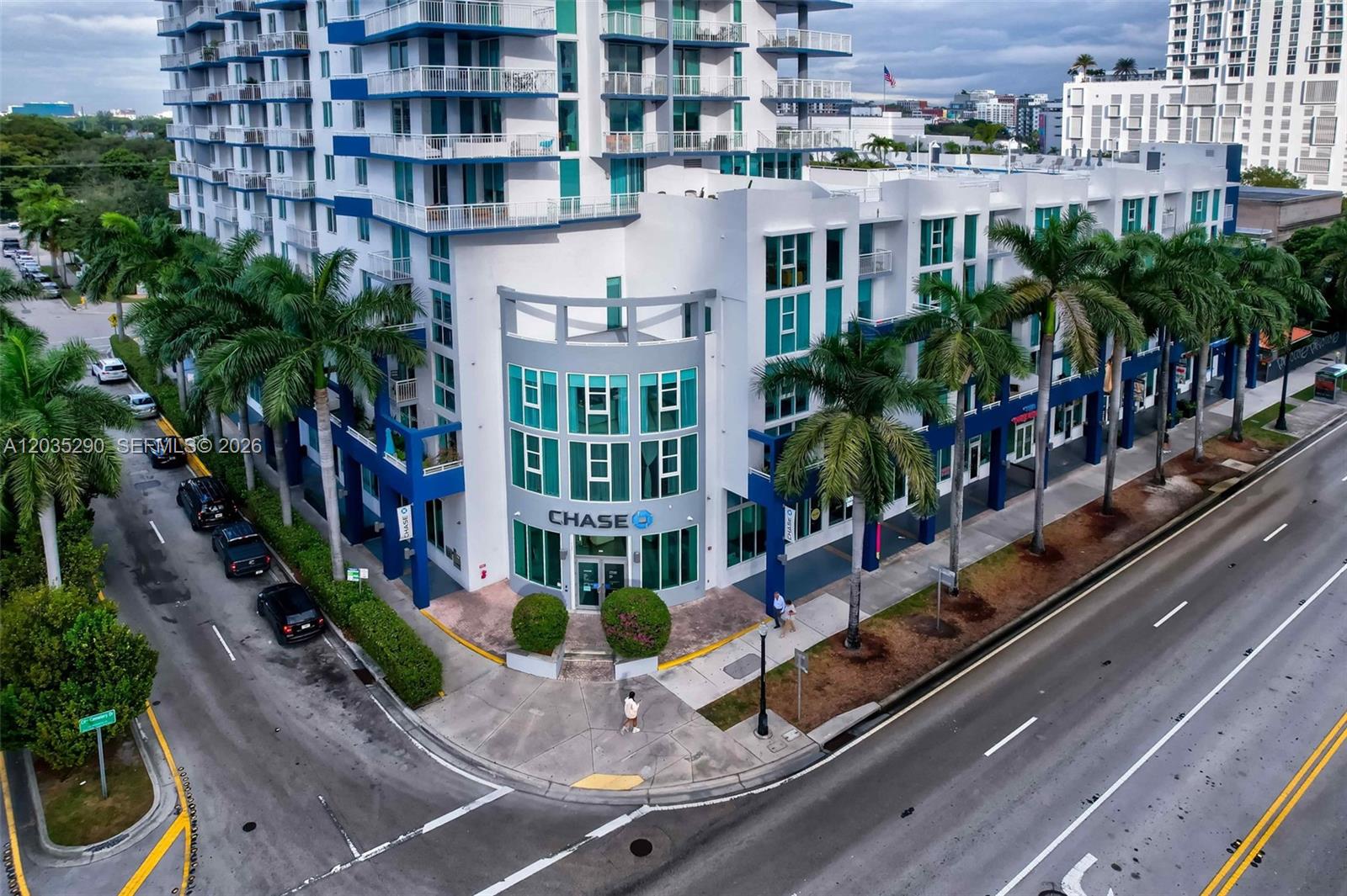 An aerial view shows a multi-story building with a Chase bank branch on the ground floor — 275 NE 18th St, Miami FL 33132, MIAMI, FL