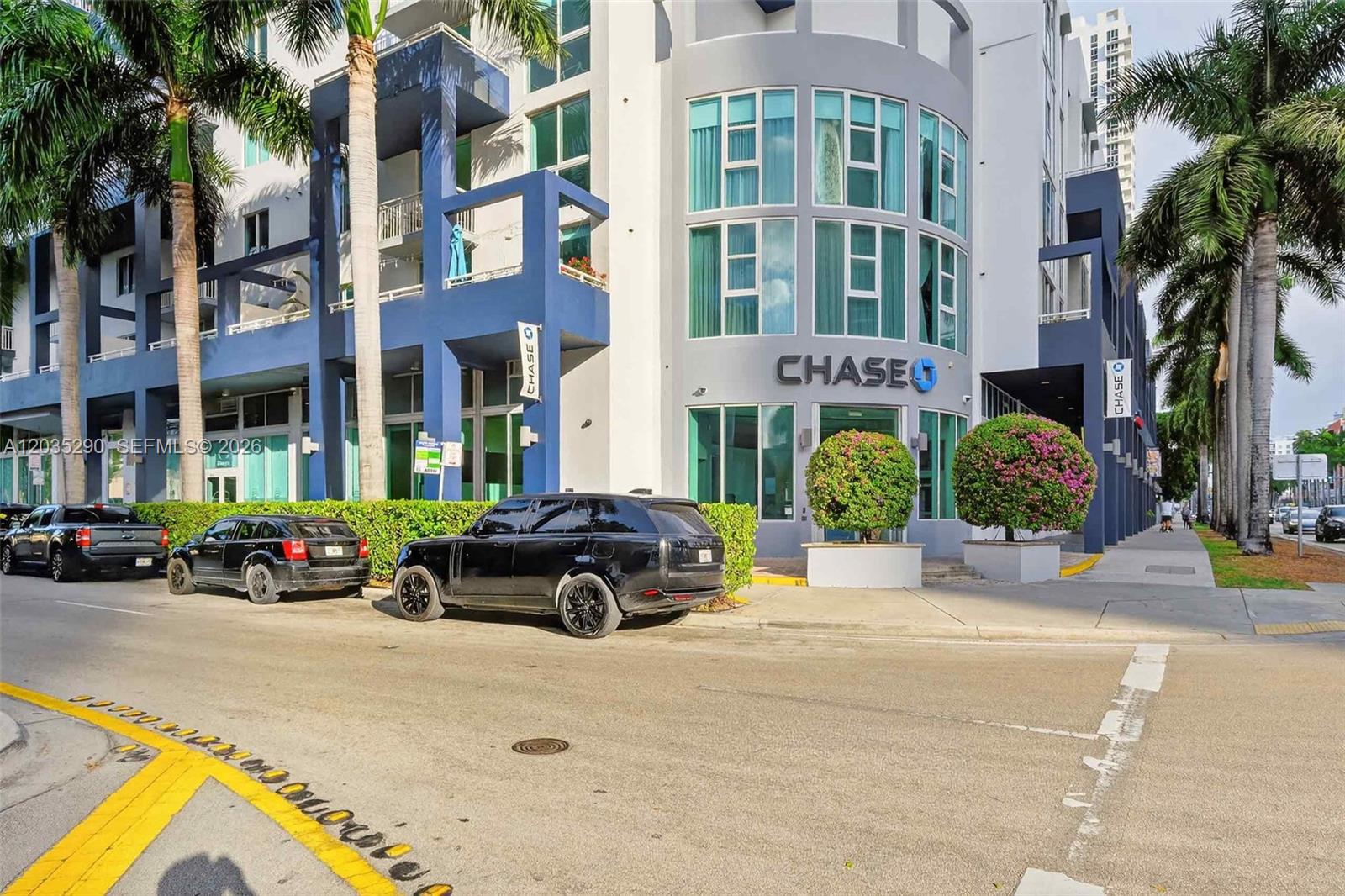 A Chase bank branch is located on the ground floor of a modern multi-story building — 275 NE 18th St, Miami FL 33132, MIAMI, FL