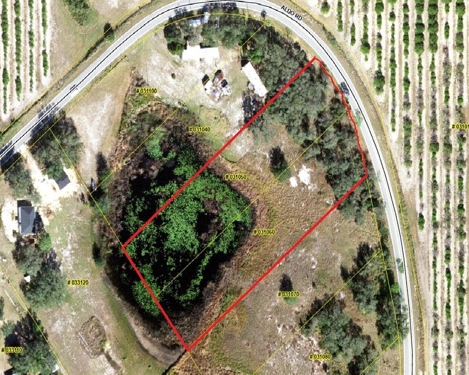 An aerial map shows a rectangular property parcel outlined in red next to a road — 1600 ALDO ROAD, BABSON PARK, FL