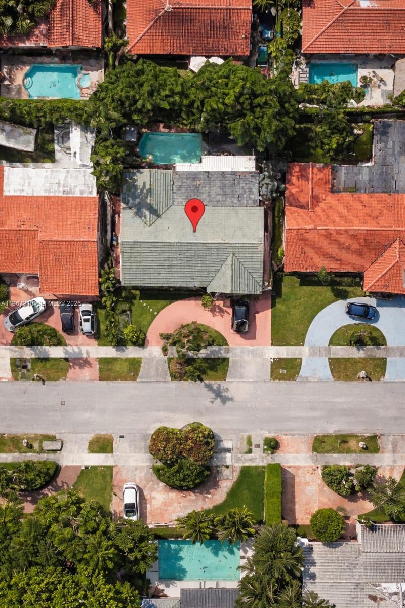 An aerial view shows a residential house with a pool and driveway in a neighborhood — 13108 SW 3rd St, Miami FL 33184, MIAMI, FL