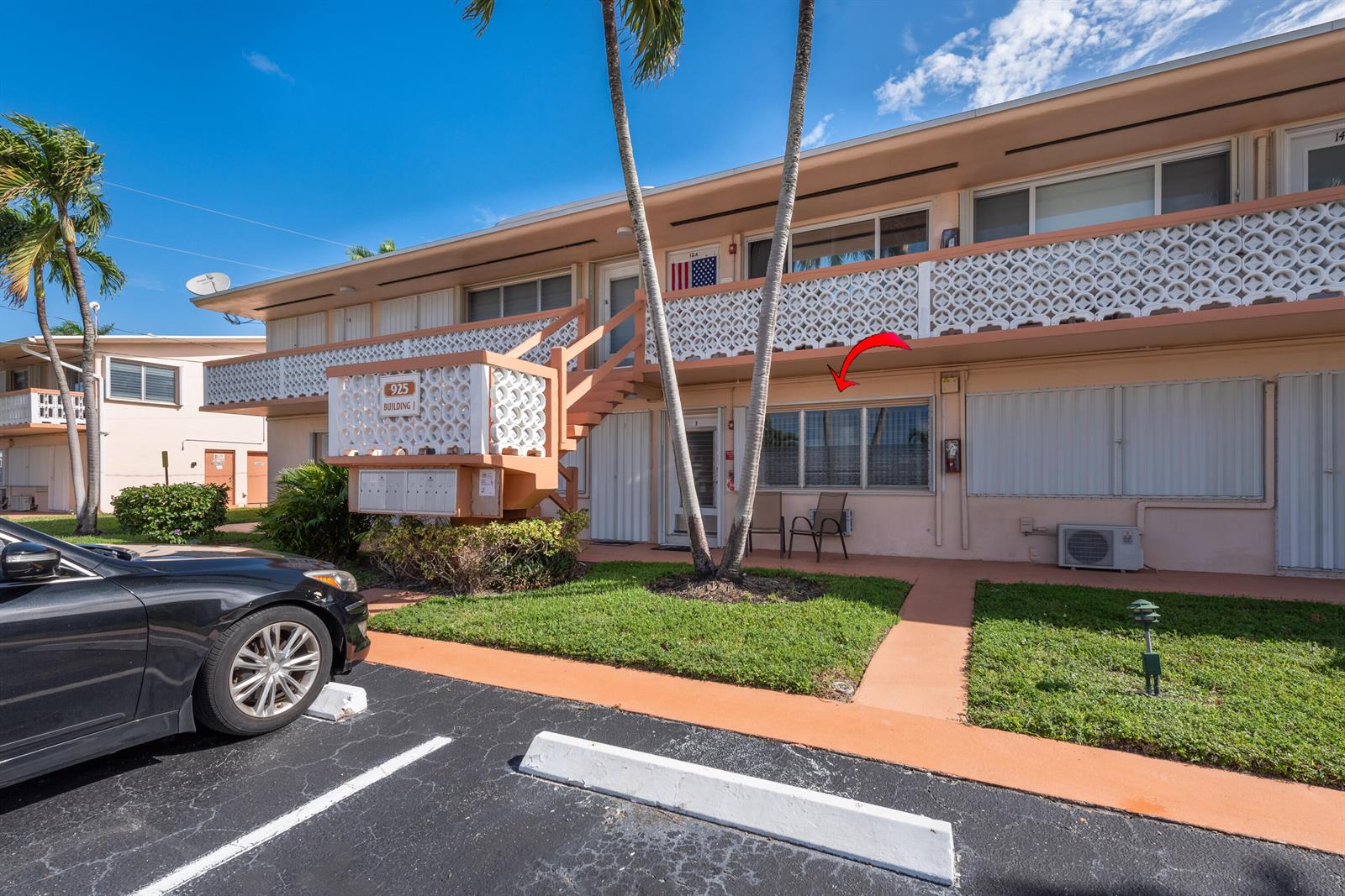 Exterior view of a two-story apartment building with a ground-floor unit marked by an arrow — 925 SW 11th Avenue # 3j, FL 33009, FL