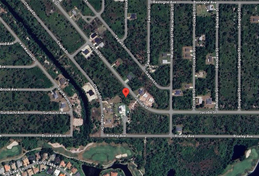 This is an aerial map view of a residential neighborhood with streets and wooded lots — 2521 & 2529 JACOBS STREET, PORT CHARLOTTE, FL