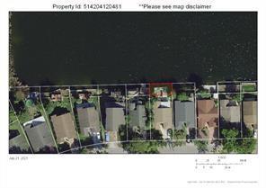 This is an aerial map view of a residential property lot bordering a lake — 28th Street, Hollywood FL 33020, HOLLYWOOD, FL