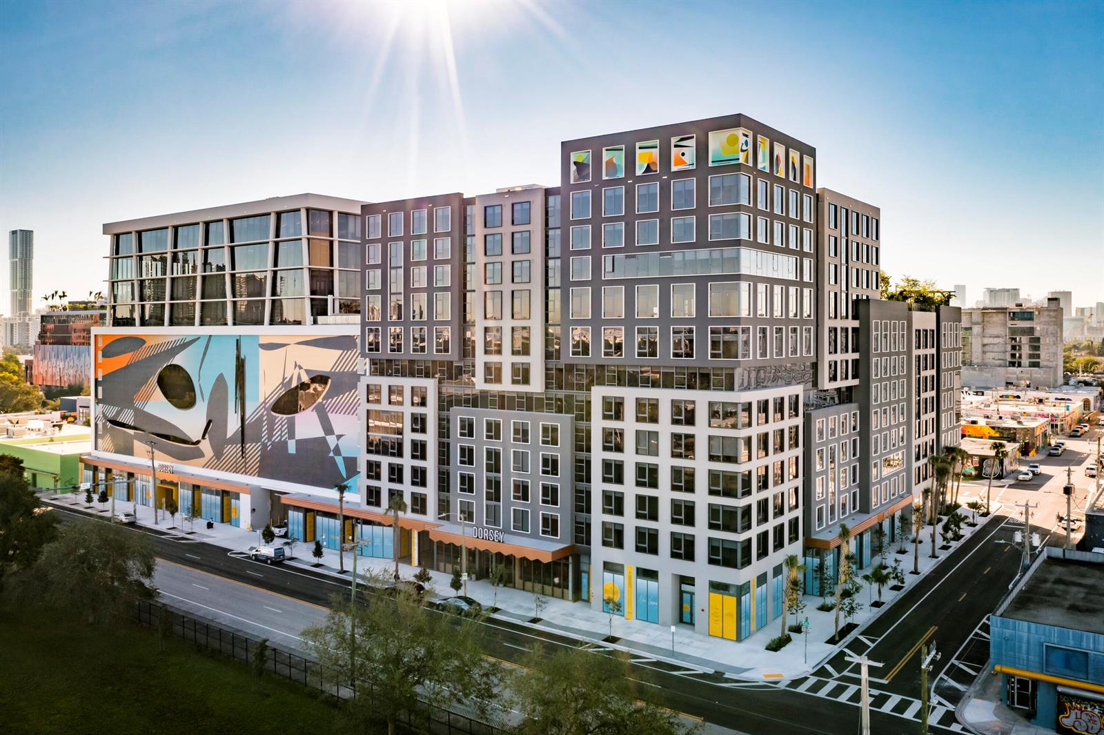 An aerial view of a modern, multi-story apartment building featuring a large exterior mural — 286 NW 29th Street # 721, Miami FL 33127, MIAMI, FL