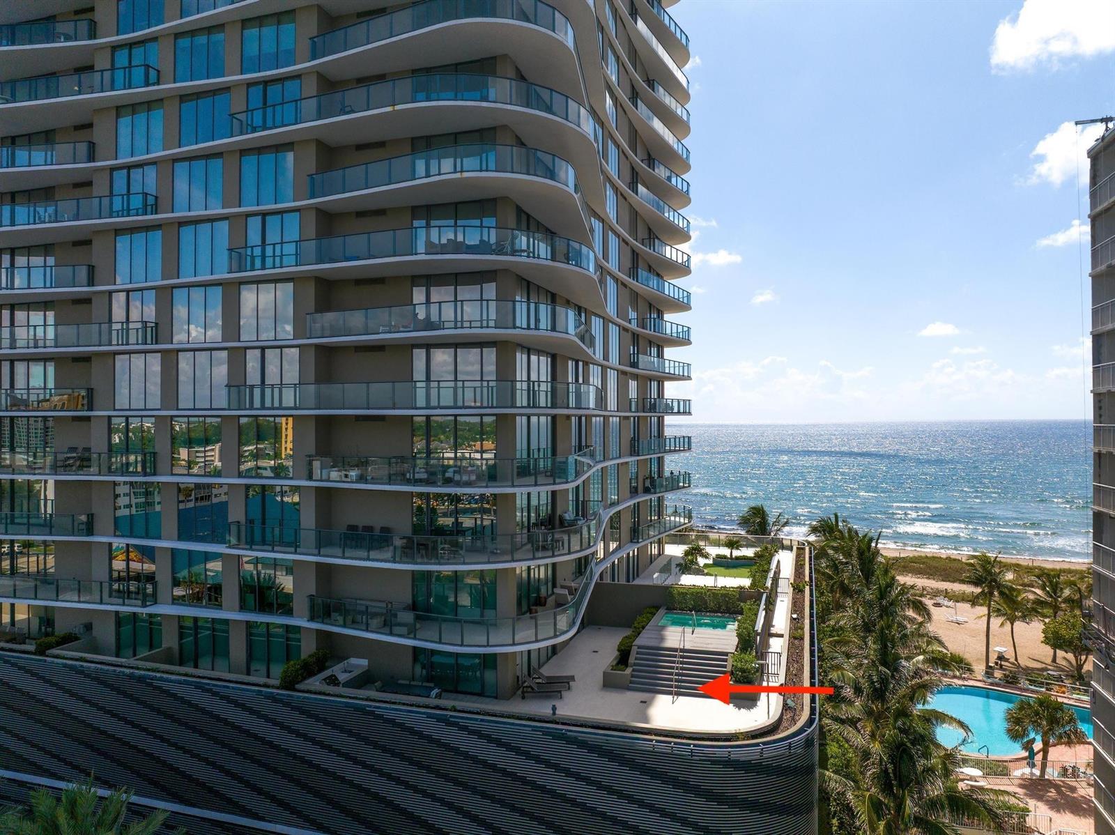 An exterior view of a high-rise building featuring a terrace with a small private pool — 730 N Ocean Boulevard # 405, Pompano Beach FL 33062, POMPANO BEACH, FL