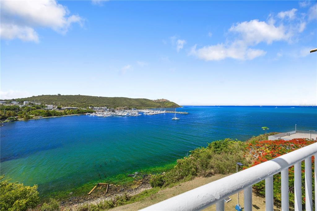 A view from a balcony overlooking a bay with a marina and boats — DOS MARINAS 4 UNIT 403, FAJARDO, PR