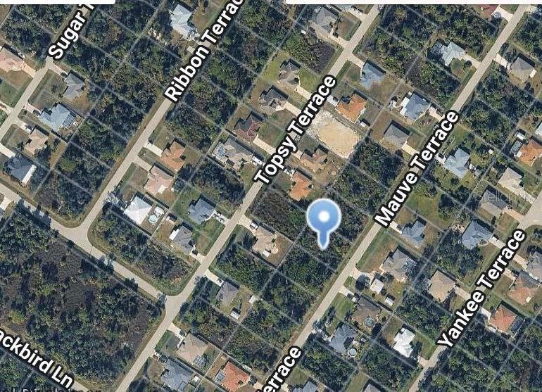 This is an aerial map view of a vacant residential lot in a suburban neighborhood — MAUVE TERRACE, NORTH PORT, FL
