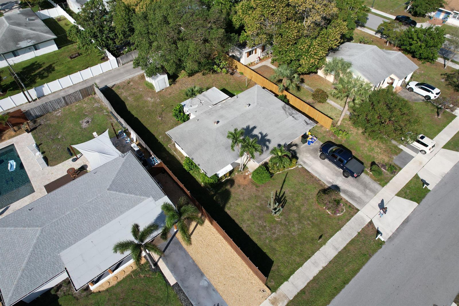 An aerial view shows two suburban houses with driveways, lawns, and fenced backyards — 910 SE 3rd Avenue, Delray Beach FL 33483, DELRAY BEACH, FL