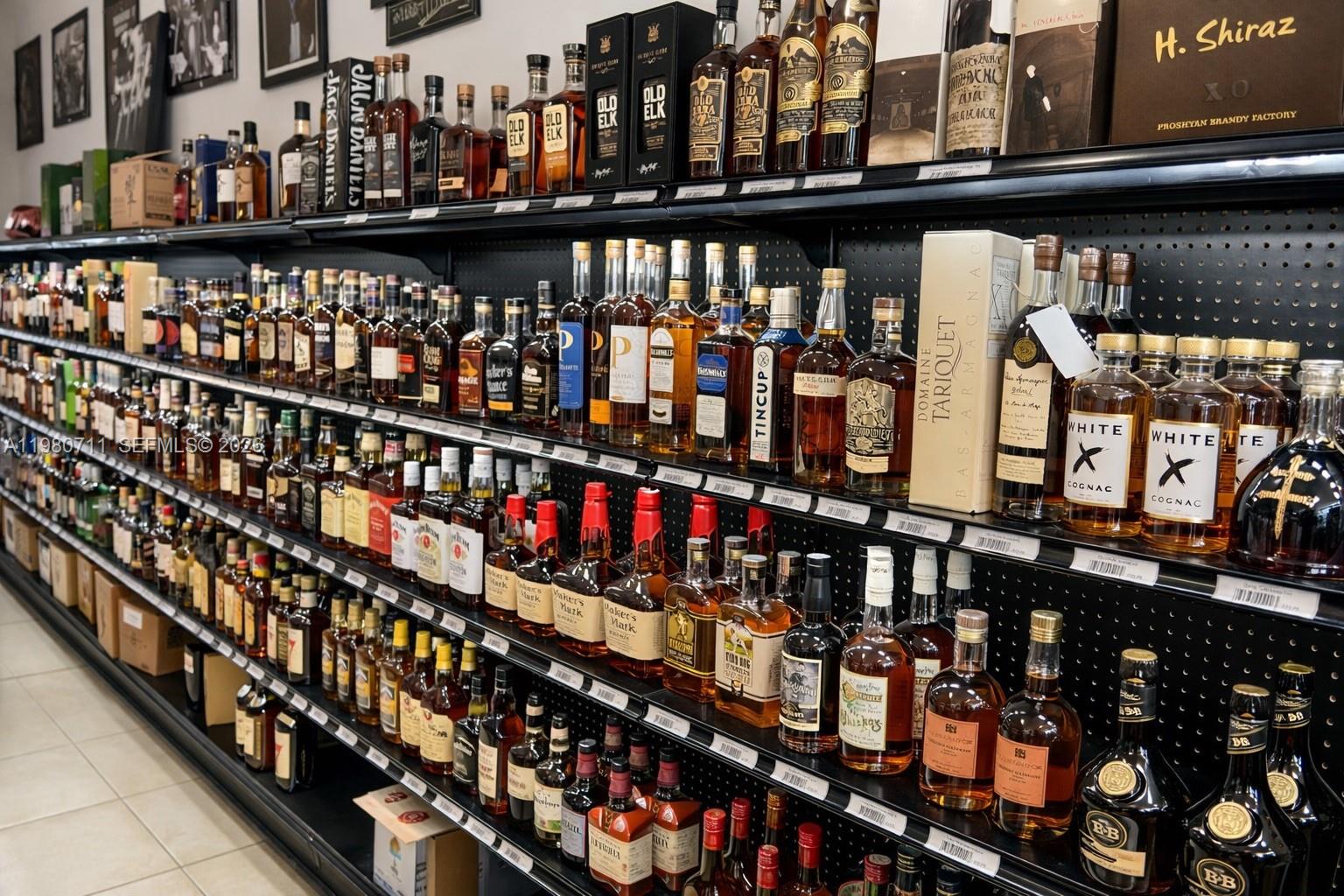Shelves in a retail store are stocked with various bottles of liquor and spirits — 1011 Hallandale Beach Blvd, Hallandale Beach FL 33009, HALLANDALE BEACH, FL