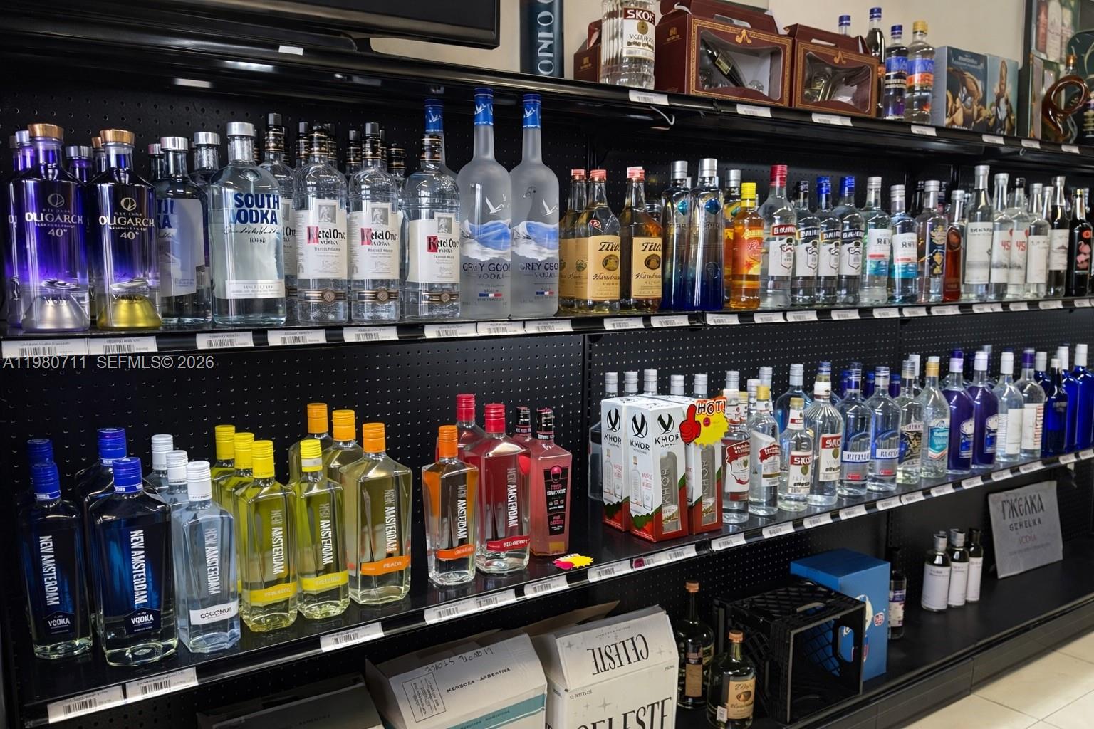 Shelves in a store are stocked with various bottles of vodka and other spirits — 1011 Hallandale Beach Blvd, Hallandale Beach FL 33009, HALLANDALE BEACH, FL
