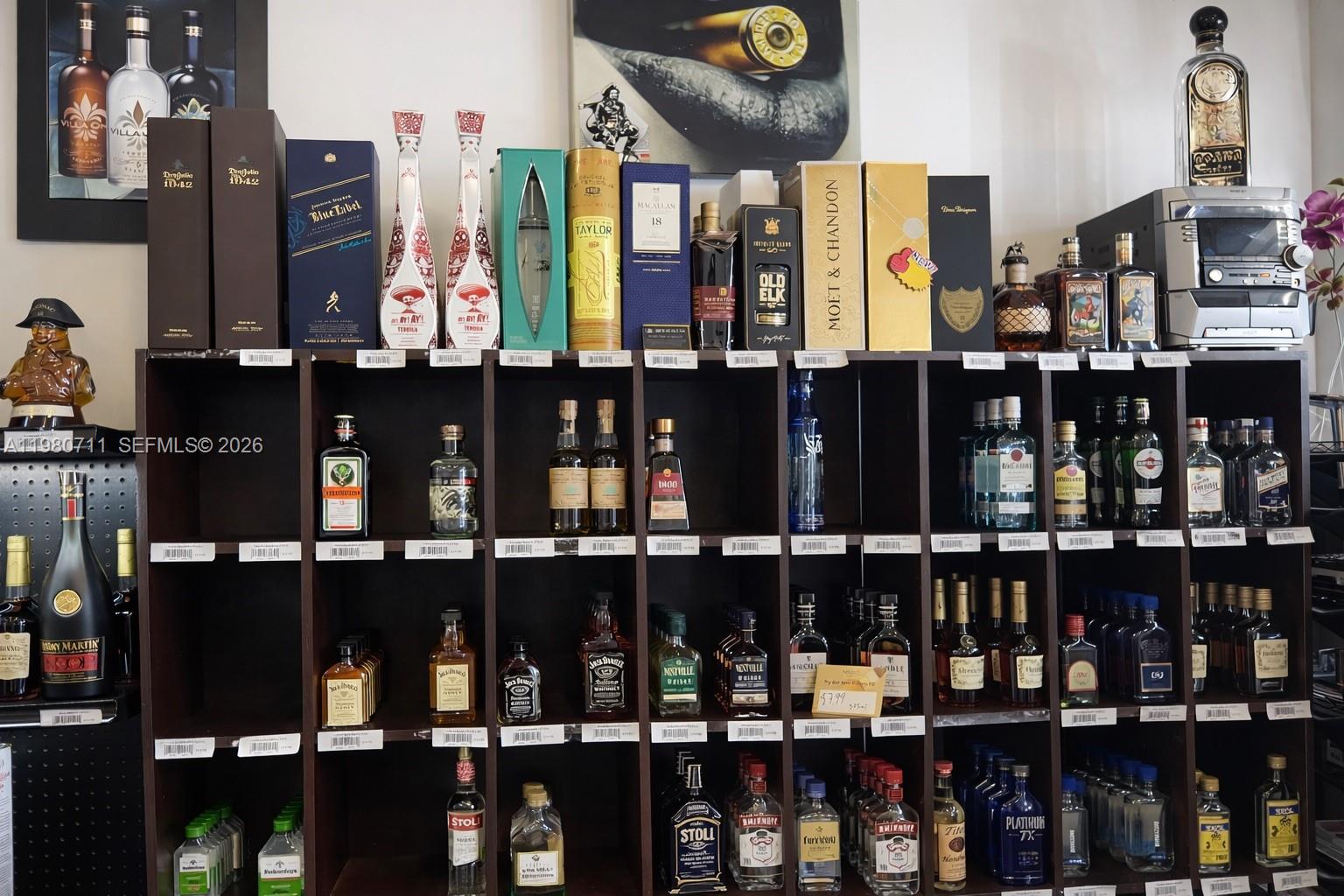 Shelves in a store are stocked with various bottles of liquor and wine — 1011 Hallandale Beach Blvd, Hallandale Beach FL 33009, HALLANDALE BEACH, FL