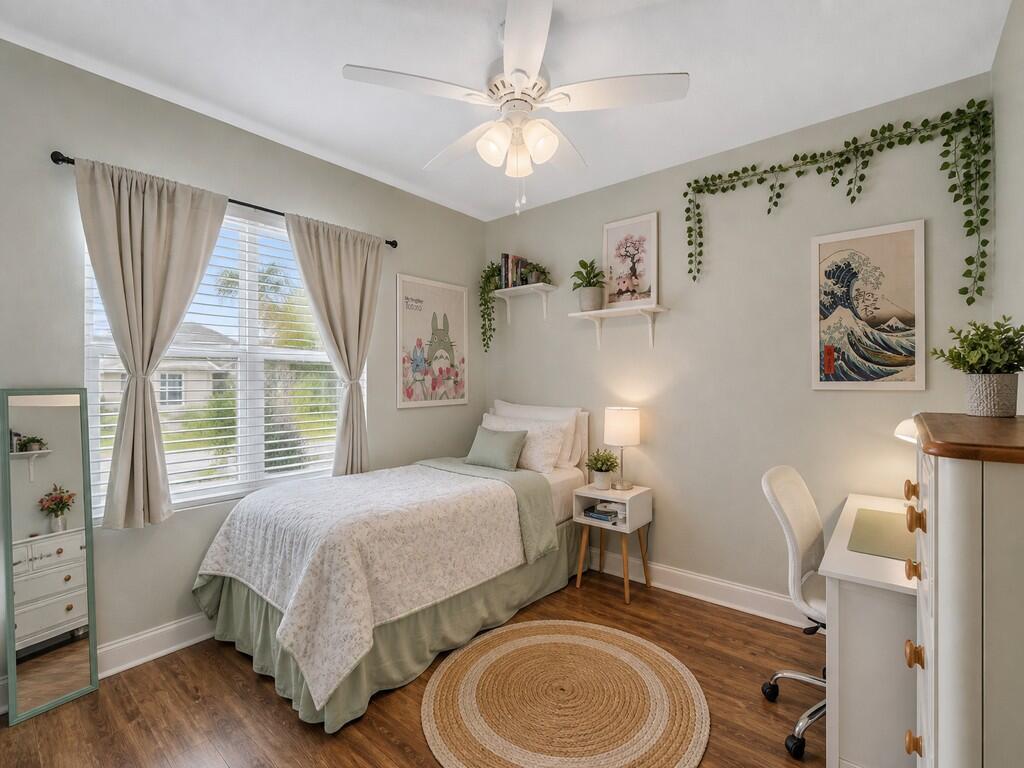 A bedroom features a twin bed, a desk, a ceiling fan, and light green walls — 475 SW Moray Dr Drive, Palm Bay FL 32908, PALM BAY, FL