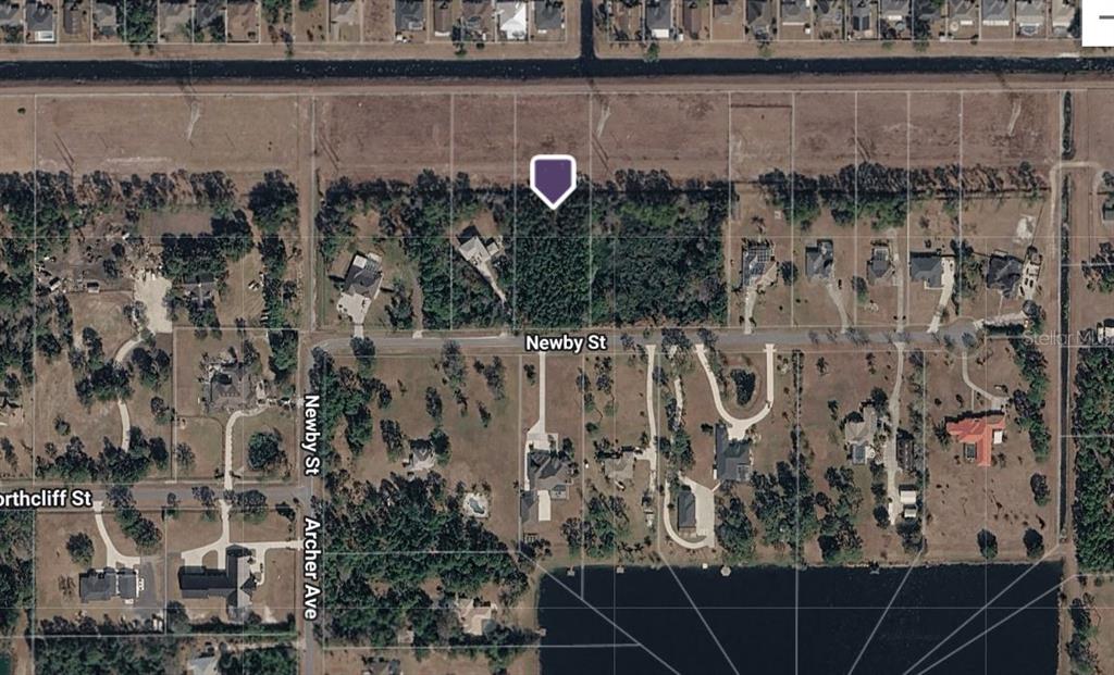 This aerial map shows a vacant, wooded residential lot situated along Newby Street — 20607 NEWBY STREET, ORLANDO, FL