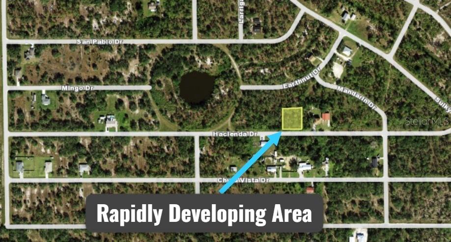 An aerial map view highlights a vacant rectangular lot located along a residential street — 27198 & 27204 HACIENDA DRIVE, PUNTA GORDA, FL