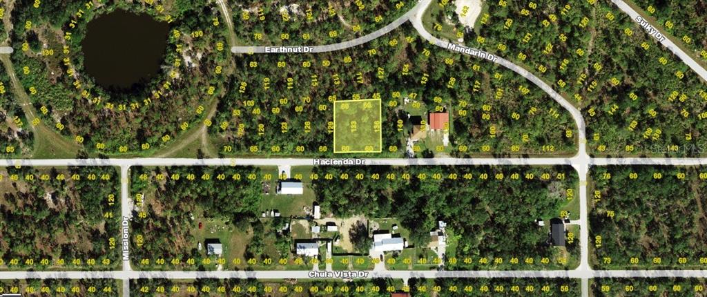 This is an aerial map showing a highlighted vacant lot on Hacienda Drive — 27198 & 27204 HACIENDA DRIVE, PUNTA GORDA, FL