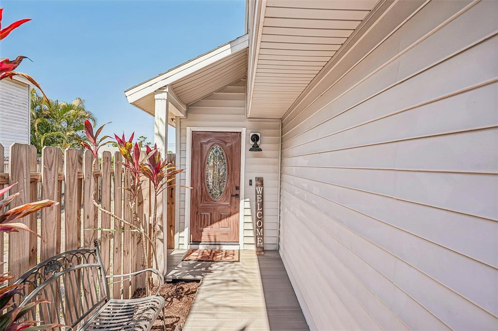 A two-story house with light siding, a single-car garage, and a concrete driveway — 5102 MOELLER AVENUE, SARASOTA, FL