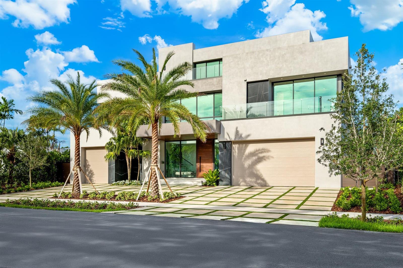 A modern two-story house with a concrete facade, large glass windows, and a paved driveway — 2000 Harbourview Drive, Fort Lauderdale FL 33316, FORT LAUDERDALE, FL