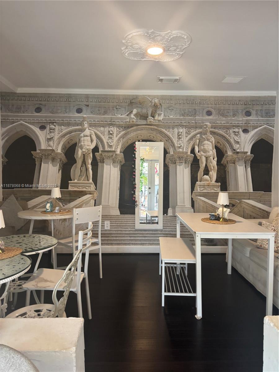 A room features a large mural of classical architecture and statues behind dining tables — 1239 Alton Rd # 3, Miami Beach FL 33139, MIAMI BEACH, FL
