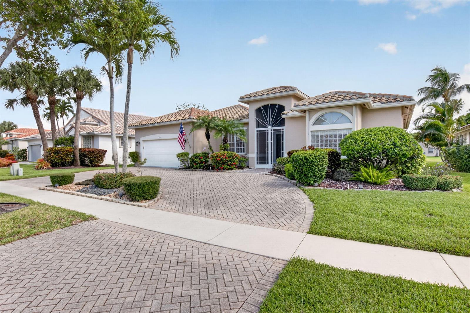 A single-story house with a tiled roof, paved driveway, and landscaped front yard — 5281 Brooklawn Terrace, Boynton Beach FL 33437, BOYNTON BEACH, FL