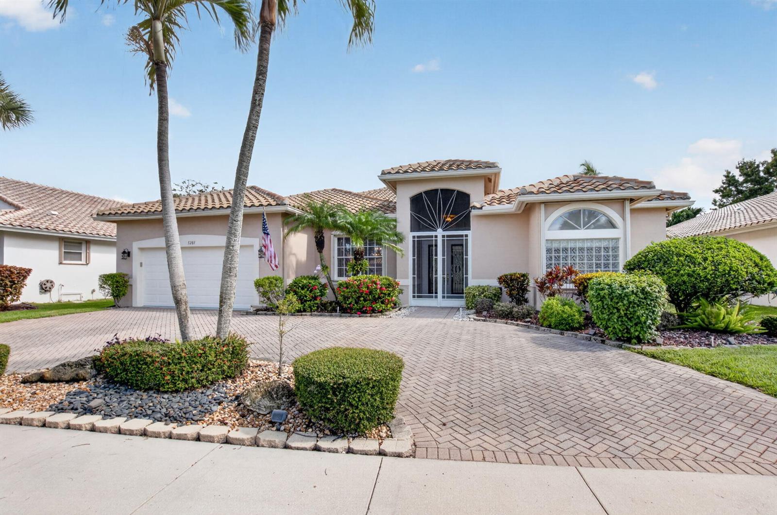 A single-story house with a tiled roof, arched entryway, and a paved circular driveway — 5281 Brooklawn Terrace, Boynton Beach FL 33437, BOYNTON BEACH, FL