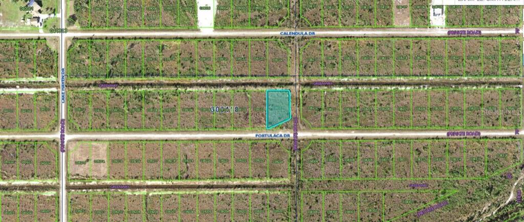 This is an aerial map showing a highlighted vacant lot located at a street intersection — 502 PORTULACA DRIVE, INDIAN LAKE ESTATES, FL
