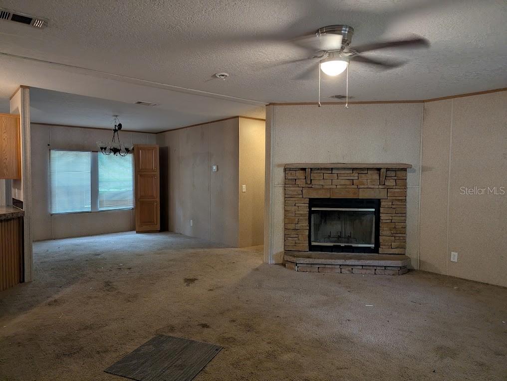 A bathroom features a double vanity with laminate countertops and a corner soaking tub — 15319 SW 114TH PLACE, ARCHER, FL