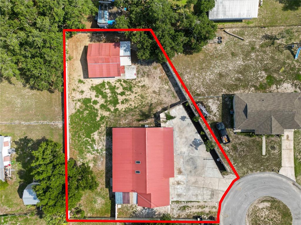 An aerial view shows a residential lot with a house, a shed, and a driveway — 4120 ORANGE AVENUE, MULBERRY, FL