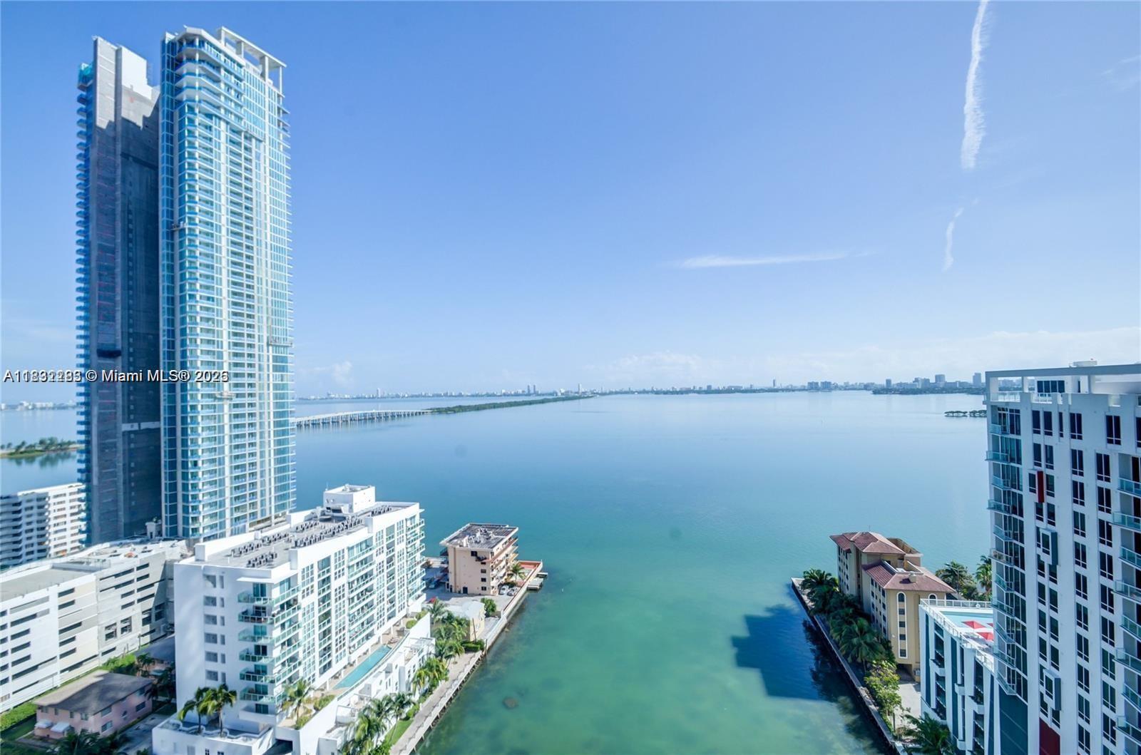 An elevated view of a bay with high-rise apartment buildings and a bridge in Miami — 460 NE 28th St # 2106, Miami FL 33137, MIAMI, FL