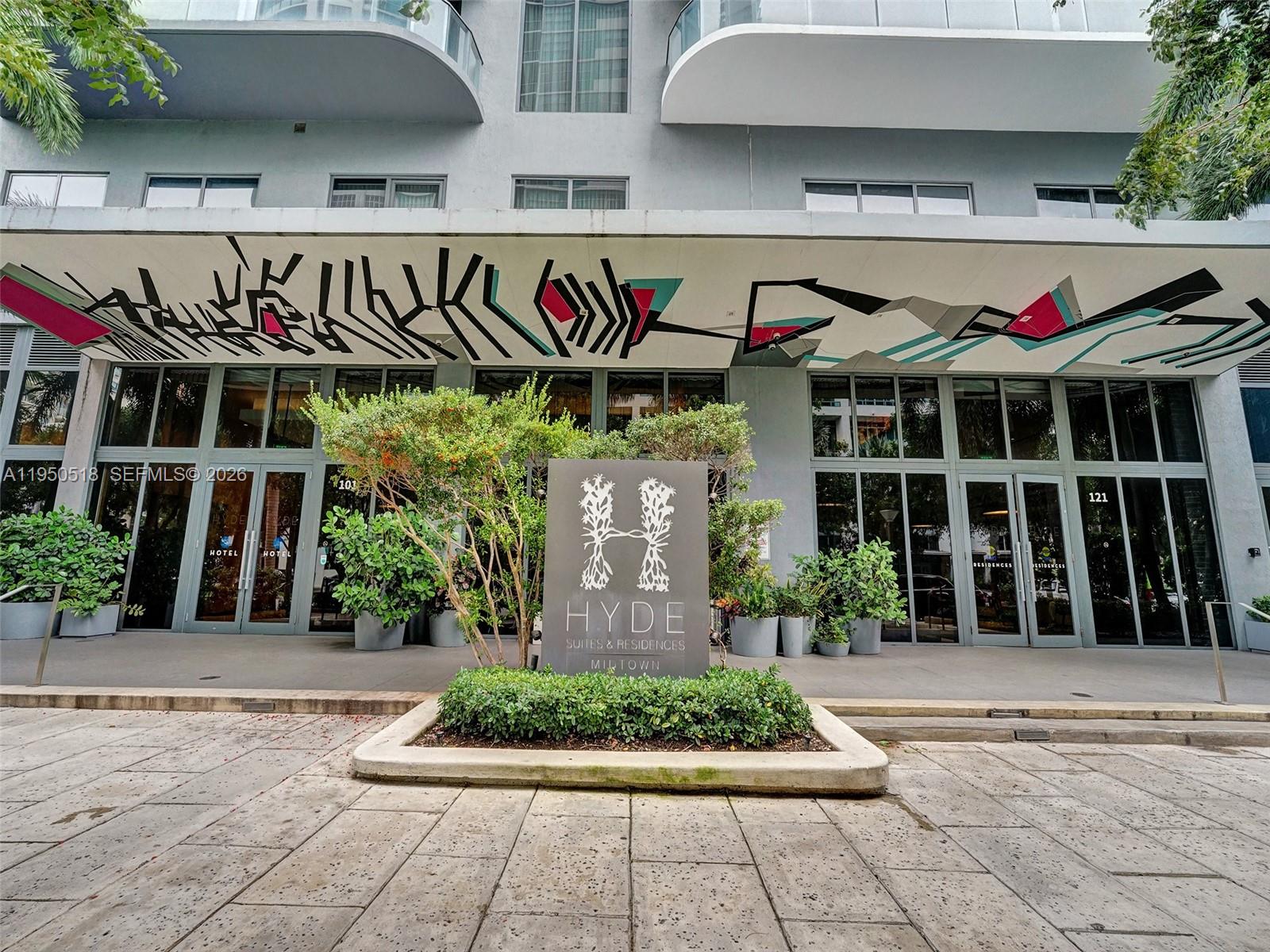 The exterior entrance of the Hyde Suites and Residences features a large mural-covered overhang — 121 NE 34th St # 2806A, Miami FL 33137, MIAMI, FL