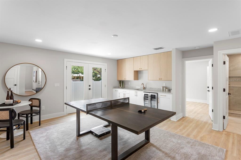 A game room features a ping pong table, a wet bar, and a small dining area — 5210 BAYSHORE BOULEVARD UNIT 3, TAMPA, FL