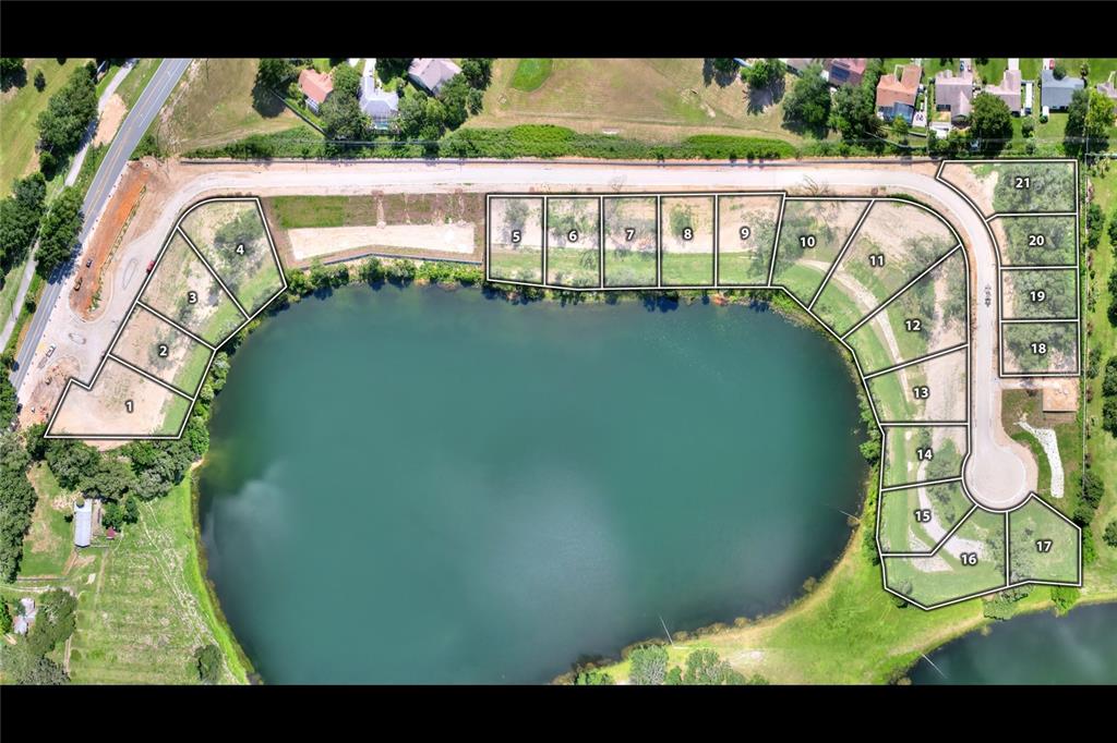 This aerial map shows a residential development with numbered lots surrounding a central lake — 133 TRANQUIL MIRROR LAKE COURT Lot 16, CLERMONT, FL