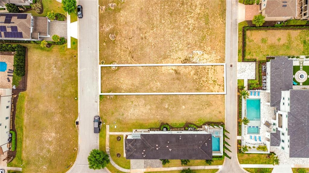 This aerial view shows a vacant rectangular residential lot situated between two paved streets — 7805 LOXAHATCHEE COURT, REUNION, FL