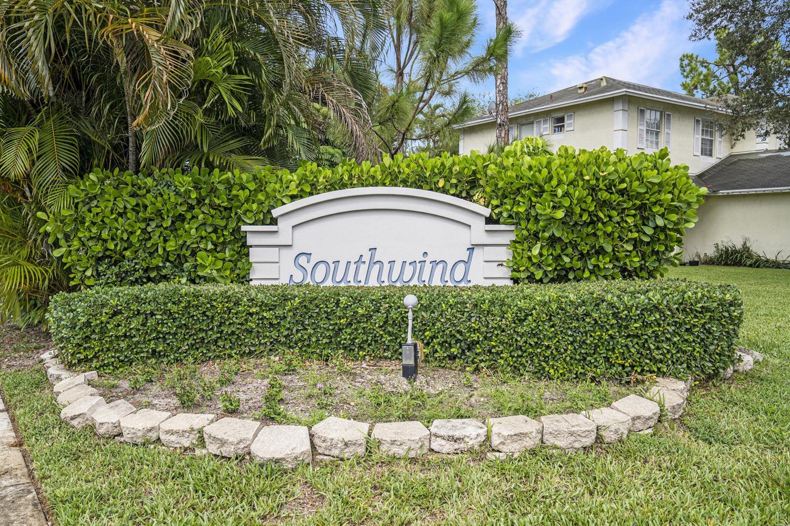 A sign reading Southwind stands in front of a manicured hedge and a residential building — 130 Baldwin Boulevard, FL 33463, FL